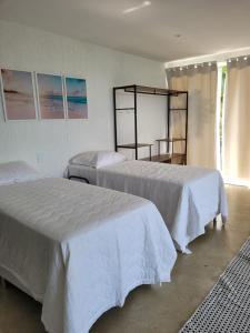 Postel nebo postele na pokoji v ubytování Alto da Piraquara Flat