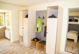 a room with a closet and a bedroom at Oberstdorf Hostel in Oberstdorf