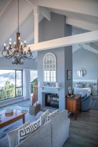 a living room with a couch and a fireplace at The Loft in Wilderness