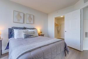 a bedroom with a large bed and a closet at Exclusive Apt in Ballston with Gym in Arlington