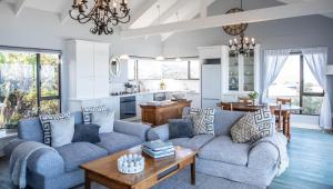 a living room with a couch and a table at The Loft in Wilderness