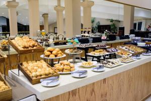 a buffet line with many different types of pastries at Lagos Del Calafate in El Calafate