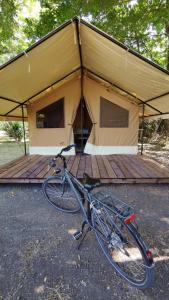 a bike parked in front of a tent at Onlycamp Tours Val de Loire in Saint-Avertin