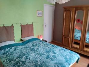 Posteľ alebo postele v izbe v ubytovaní La petite maison de Paule