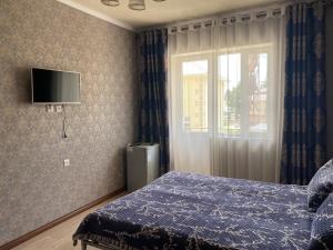 TV a/nebo společenská místnost v ubytování Asem Guest House