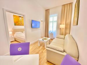 Televízia a/alebo spoločenská miestnosť v ubytovaní Steiner Residences Vienna Nestroyplatz
