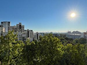 a view of a city with the sun in the sky at Milan in Belgrade