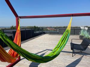 a pair of hammocks on a roof at Radio city loft in Kaunas