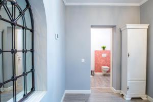 a hallway with a glass door leading to a bathroom at Casa Brainer in Sibiu +82 photos
