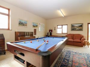 a living room with a pool table in it at Courtyard Cottage in Duns
