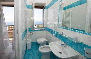 Koupelna v ubytování Hotel Calanca
