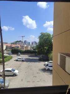 a view of a parking lot with cars parked at Apartments Haagna in Ashdod