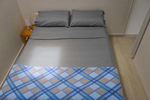 a bed in a small room with a bed frame at Villa Namaste, Cabaña Namaste 1 in Curití +25 photos