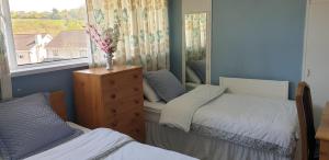 Voodi või voodid majutusasutuse Farnham House toas