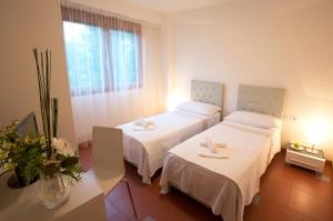 Posteľ alebo postele v izbe v ubytovaní Lacroma Aparthotel