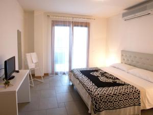 Posteľ alebo postele v izbe v ubytovaní Lacroma Aparthotel