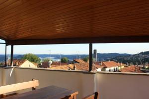 a view from the balcony of a house with a wooden roof at Casa Lia in Lesa