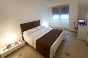 Posteľ alebo postele v izbe v ubytovaní Lacroma Aparthotel
