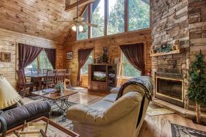 a living room with a couch and a fireplace at Awesome Honey Bear- Get 951 worth of FREE area attraction tickets for each paid day!!! in Sevierville