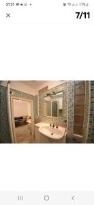 a bathroom with a sink and a mirror at da Antonio in Foligno