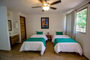 Postel nebo postele na pokoji v ubytování Hotel Tequila Cancun