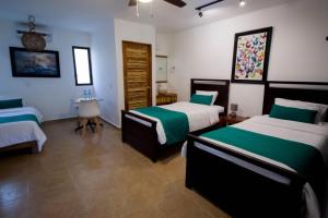 Postel nebo postele na pokoji v ubytování Hotel Tequila Cancun