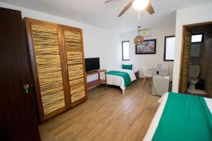 Postel nebo postele na pokoji v ubytování Hotel Tequila Cancun