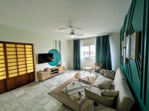 Ruang duduk di TAHITI - Orovini Cottage