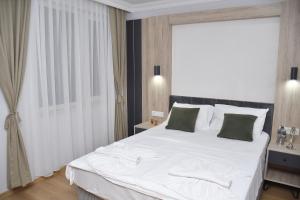 Postel nebo postele na pokoji v ubytování Hotel Arinna