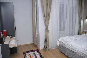 Postel nebo postele na pokoji v ubytování Hotel Arinna