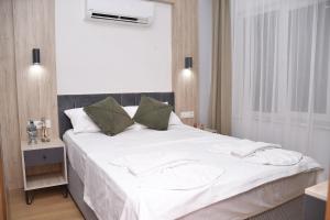 Postel nebo postele na pokoji v ubytování Hotel Arinna