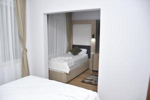 Postel nebo postele na pokoji v ubytování Hotel Arinna