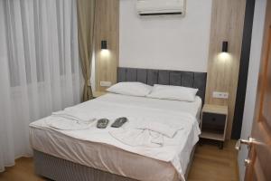 Postel nebo postele na pokoji v ubytování Hotel Arinna
