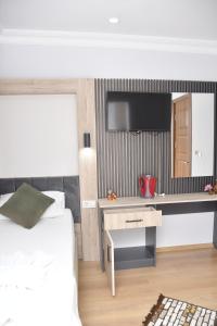 TV a/nebo společenská místnost v ubytování Hotel Arinna