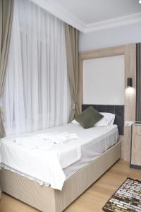 Postel nebo postele na pokoji v ubytování Hotel Arinna
