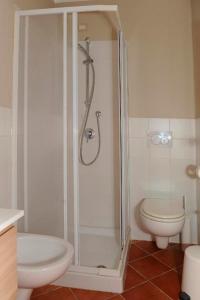 a bathroom with a shower and a toilet at Condotta3Rooms in Florence