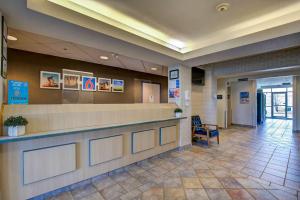 a lobby of a hospital with a reception counter at Motel 6-Grande Prairie, AB in Grande Prairie