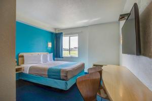 a hotel room with a bed and a window at Motel 6-Grande Prairie, AB in Grande Prairie +18 photos