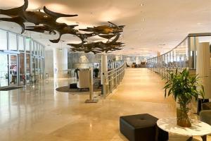 a large lobby with a ceiling with a whale sculpture at Hotel Nacional Rio De Janeiro in Rio de Janeiro