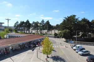 a group of people standing outside of a building with a christmas tree at Casa Avé Maria in Fátima +4 photos