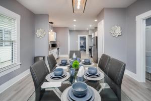 a dining room and kitchen with a table and chairs at Spacious Home Near Downtown San Antonio in San Antonio