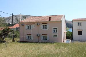 a house in the middle of a field at Triple Room Metajna 6378d in Metajna +11 photos