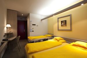Postel nebo postele na pokoji v ubytování Hotel Marzia