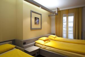 Postel nebo postele na pokoji v ubytování Hotel Marzia