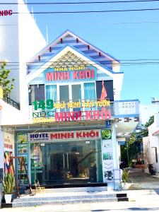 a building with a million kingdom sign on it at Minh Khoi Guest House in Mui Ne