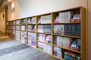 a book shelf filled with lots of books at Rinn Niomon in Kyoto