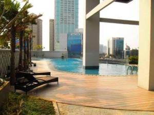 a swimming pool on the roof of a building at Strategic Cozy Hang Out Apartment, GP Plaza in Jakarta