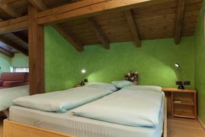 Postel nebo postele na pokoji v ubytování Hotel Marzia