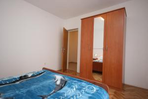 Ένα ή περισσότερα κρεβάτια σε δωμάτιο στο Apartment Stara Novalja 6375c