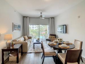 a living room with a table and a couch at Pet Friendly in Orlando area near Disney in Orlando